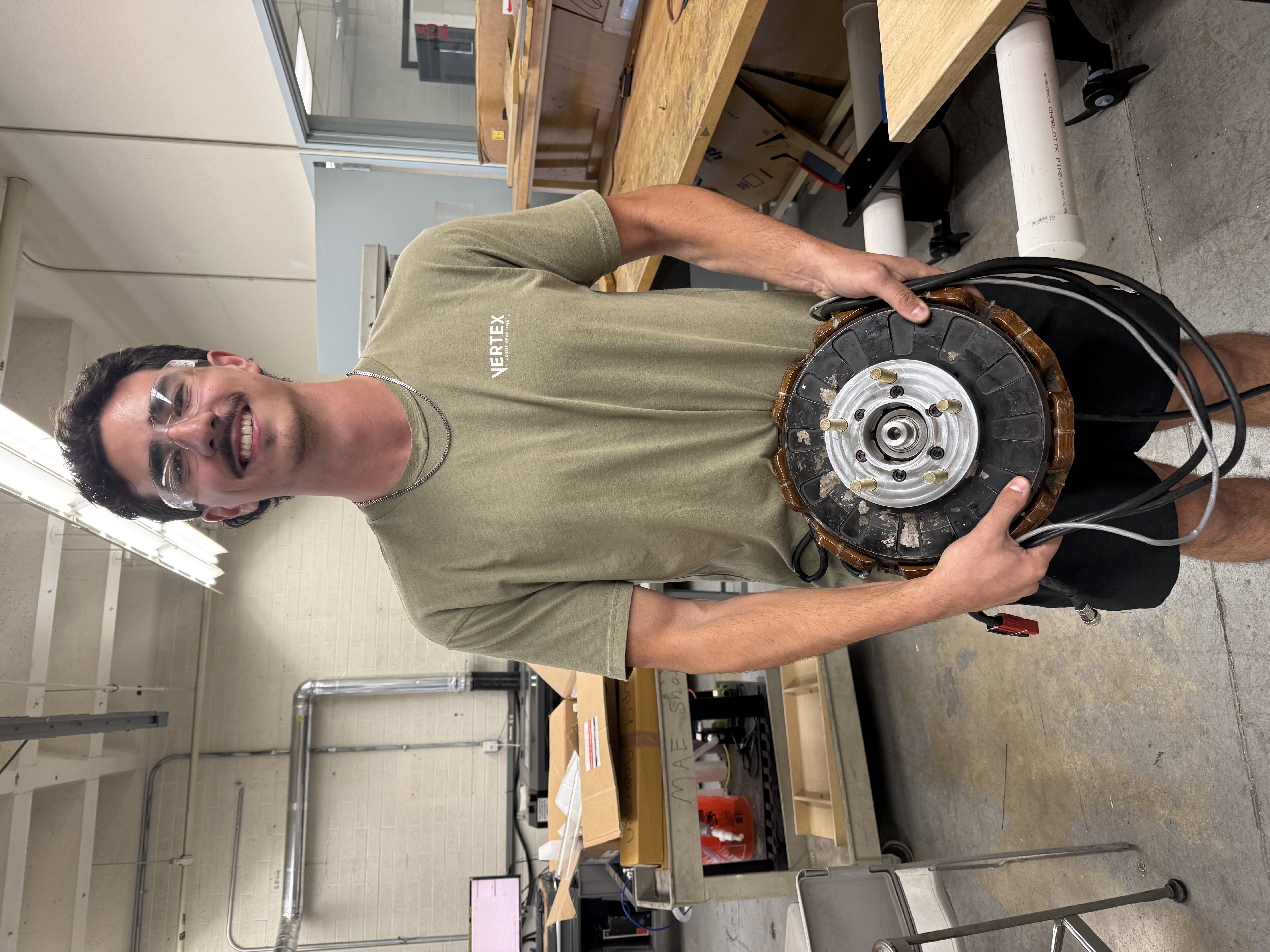 Me holding our electric motor and wheel adapter (so heavy!)